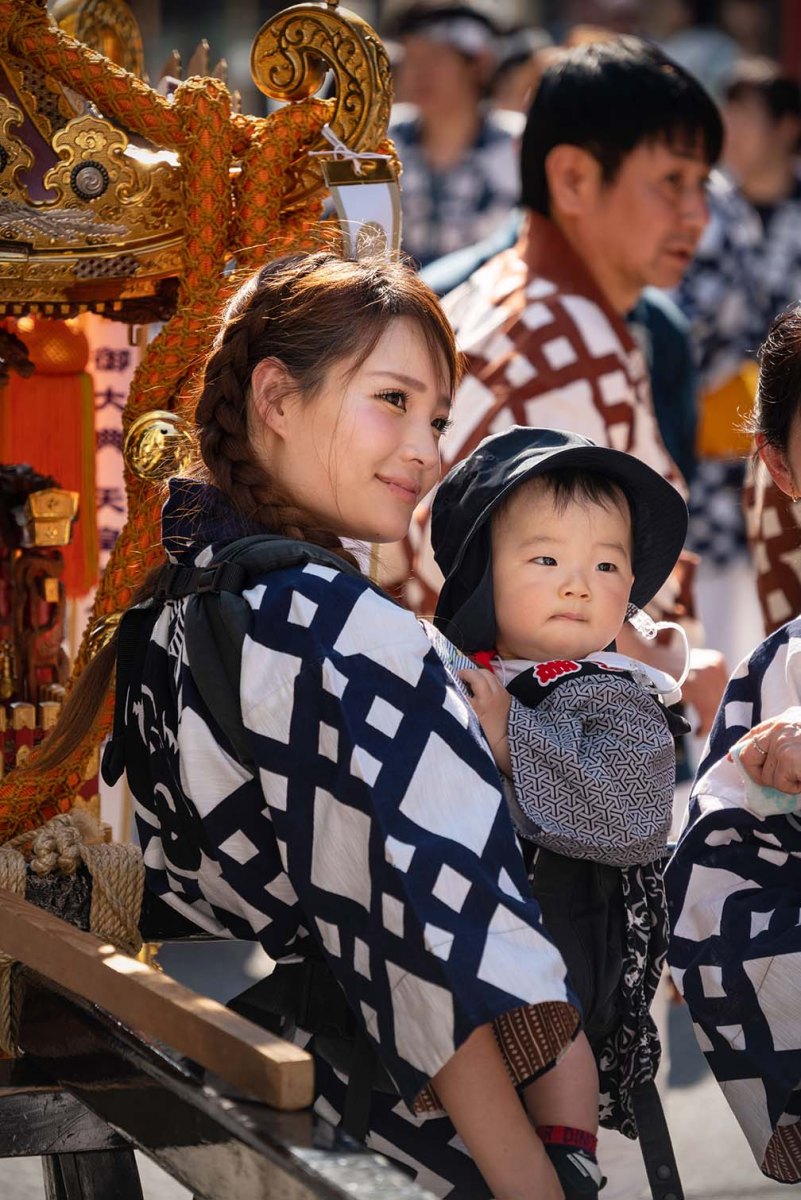 Two cutie-pies near the portable shrine